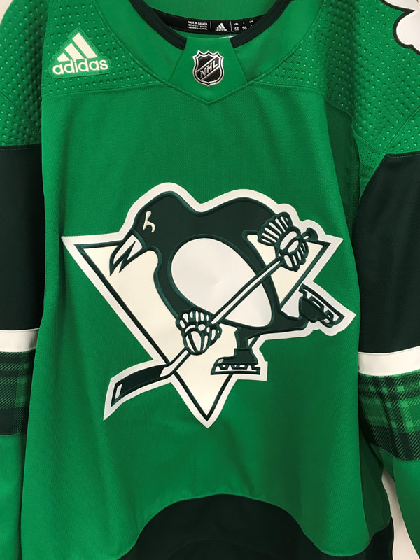 Pittsburgh Penguins center Sidney Crosby (87) wears a green jersey during  warmups on St. Patrick's Day before the start of the Philadelphia Flyers  game at PPG Paints Arena in Pittsburgh on March